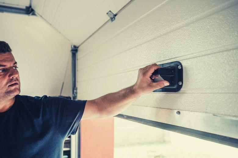Manually close and open the garage door is one of the steps in the garage door balance check.