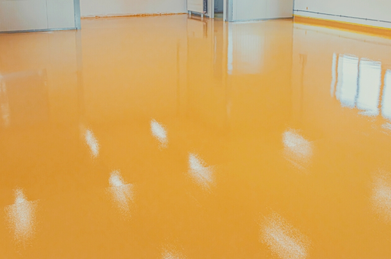 Epoxy floor vs tile: Cleaning up an epoxy floor requires a simple sweep.