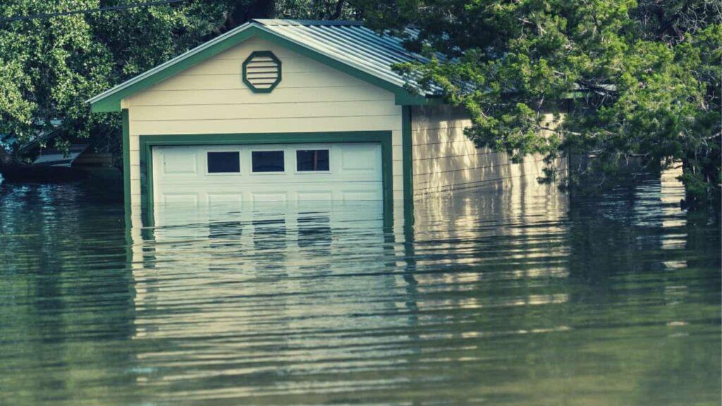 A garage submerged in flood waters after homeowners forgot to take maintenance steps that are crucial in a process on how to keep water out of garage