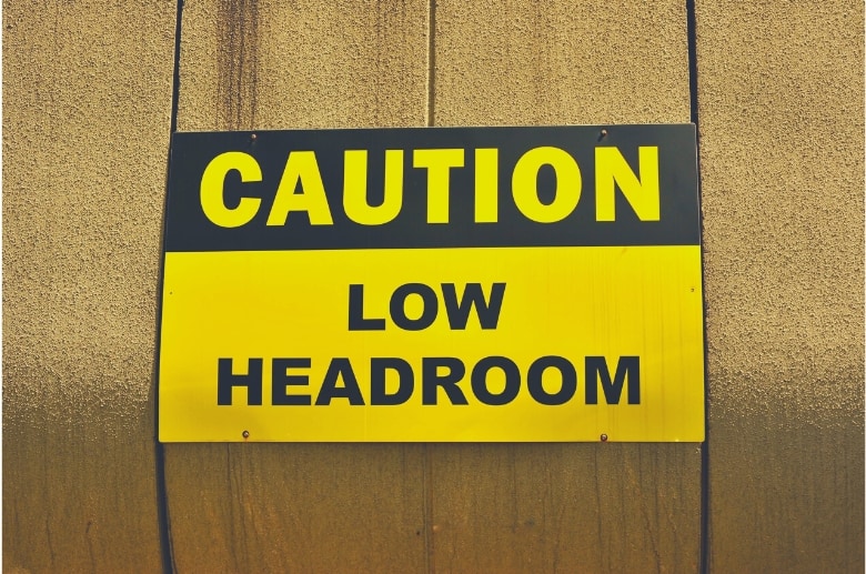 A low headroom is a term where there is not enough vertical space above the garage door opener to open the garage door.