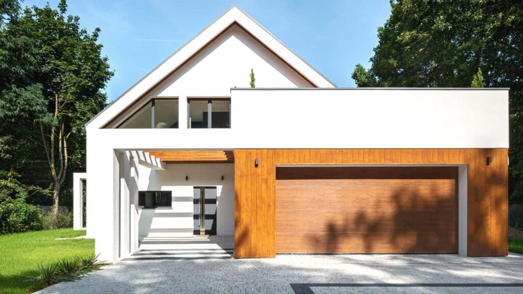 House with wood garage door that is one of the different garage door material types to choose from