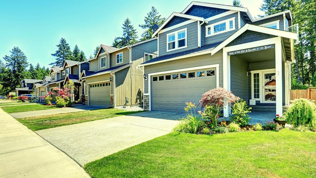 grass classic houses and their garage doors