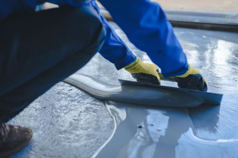 Hire a professional to apply an epoxy garage floor coating.