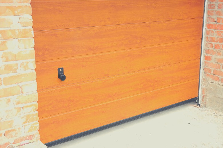 Insulated wood garage door is used for certain garages.