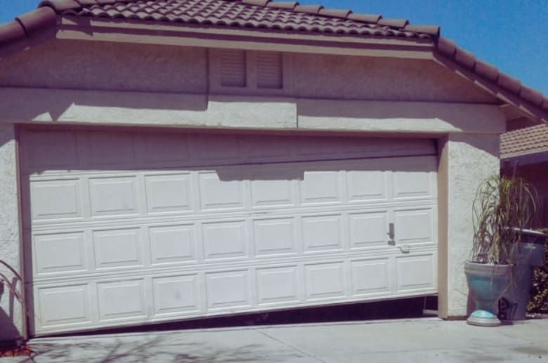 Garage door does not open properly because both cables off