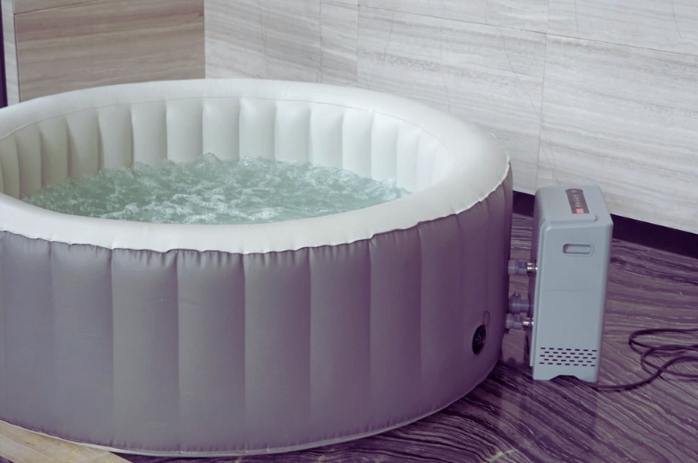 An inflatable hot tub in garage.
