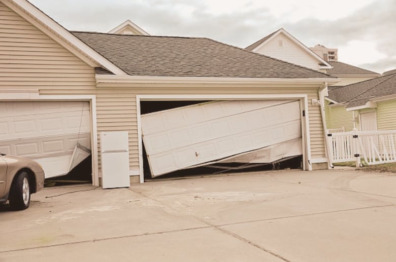 A dented garage door. Look for dents if you have garage doors problems.