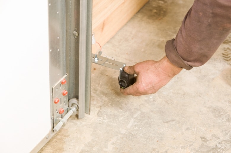 Checking the garage door sensor if they are clean and aligned. Check this if your garage door jerks when closing. 