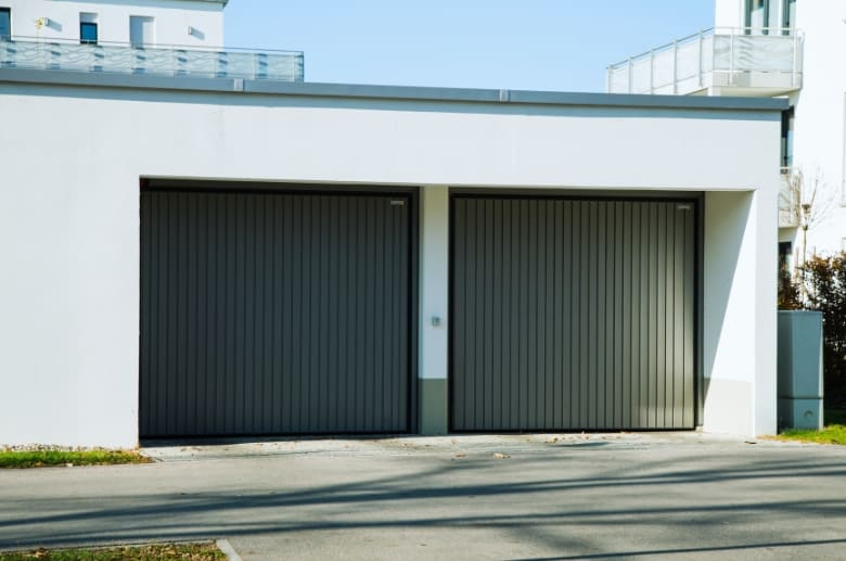 A garage door with ribbed garage door panels.