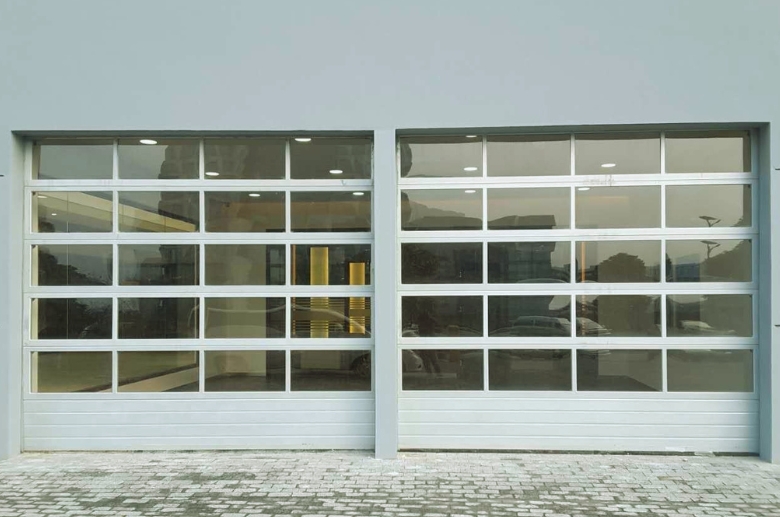 A full view glass panel garage door. It is one of the stylish glass panel garage doors.