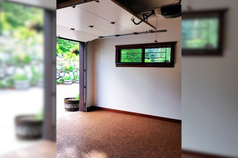 A window in a garage. It is one of the options for residential garage ventilation.