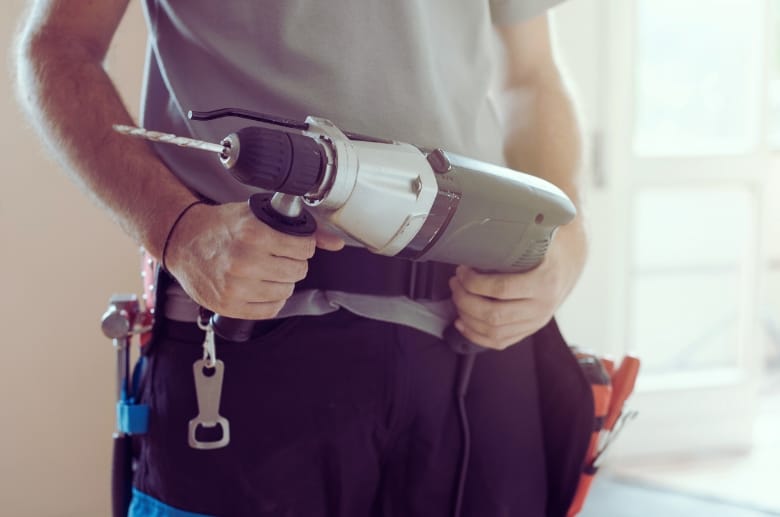 A man with a drill. Use this when you are locked out of garage door.