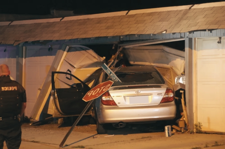 A car crashed into the garage door.